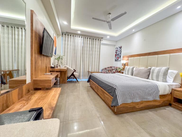 Super Deluxe room for corporate guests at Hotel Golf View Sakura & Suites, Golf Course Road